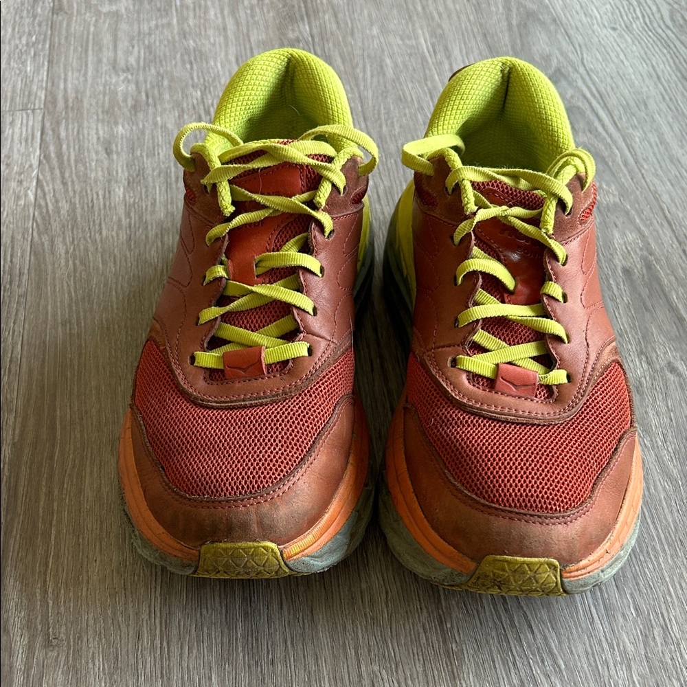 Hoka Red-Orange Running Shoes with Neon Yellow Accents